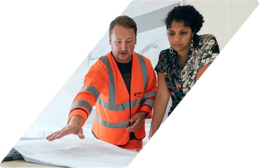 Engineers looking at blueprints