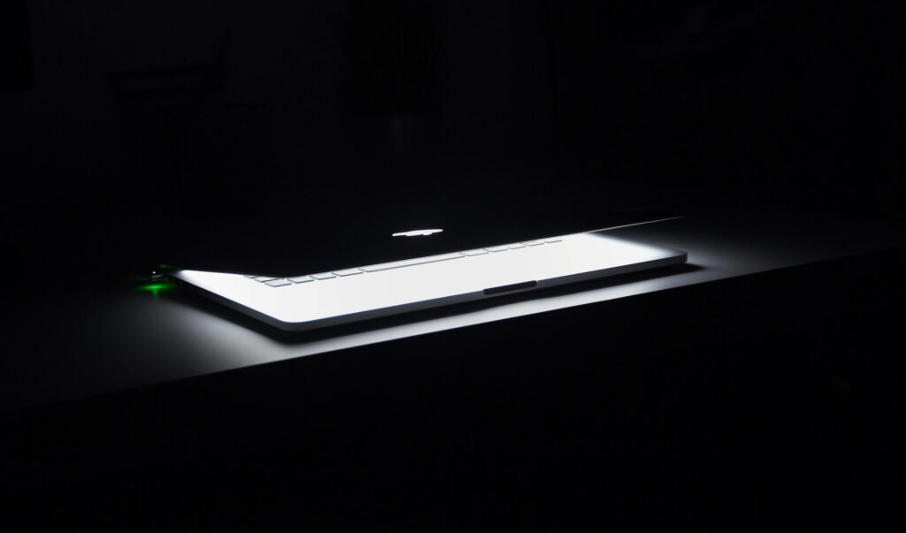 A closing laptop symbolizing the serious decisions around firing an employee in California