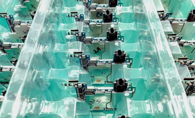 A microchip assembly line representing the semiconductor manufacturing workforce