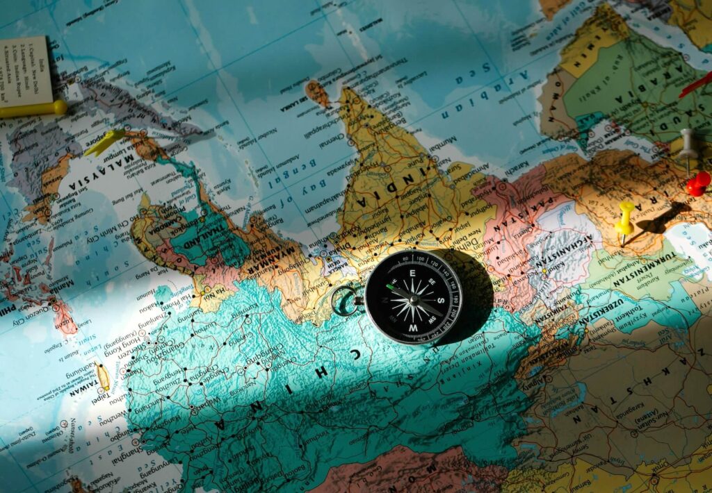 A compass on a map symbolizing direction and professional development goals
