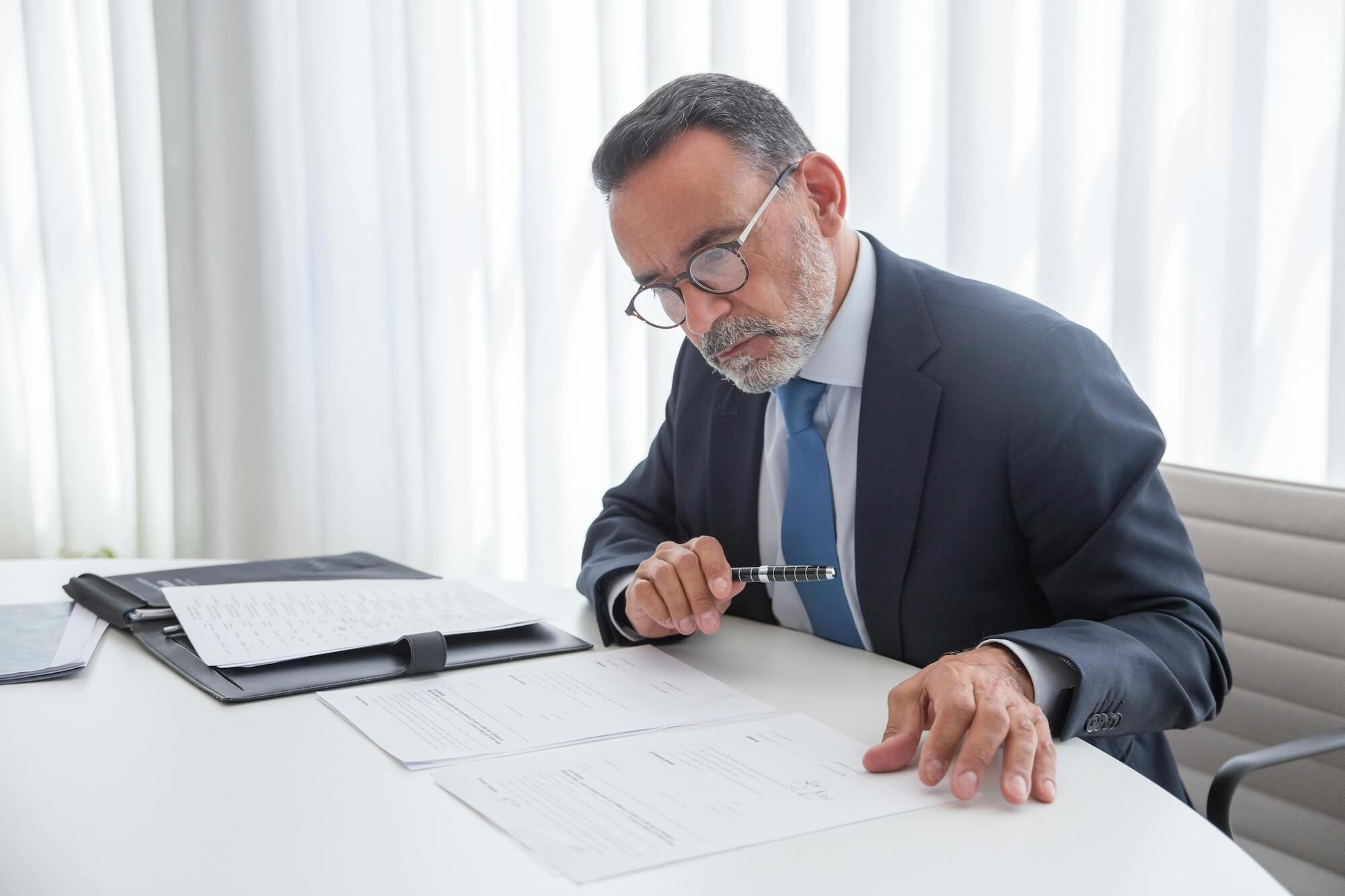 A business professional reviewing documents
