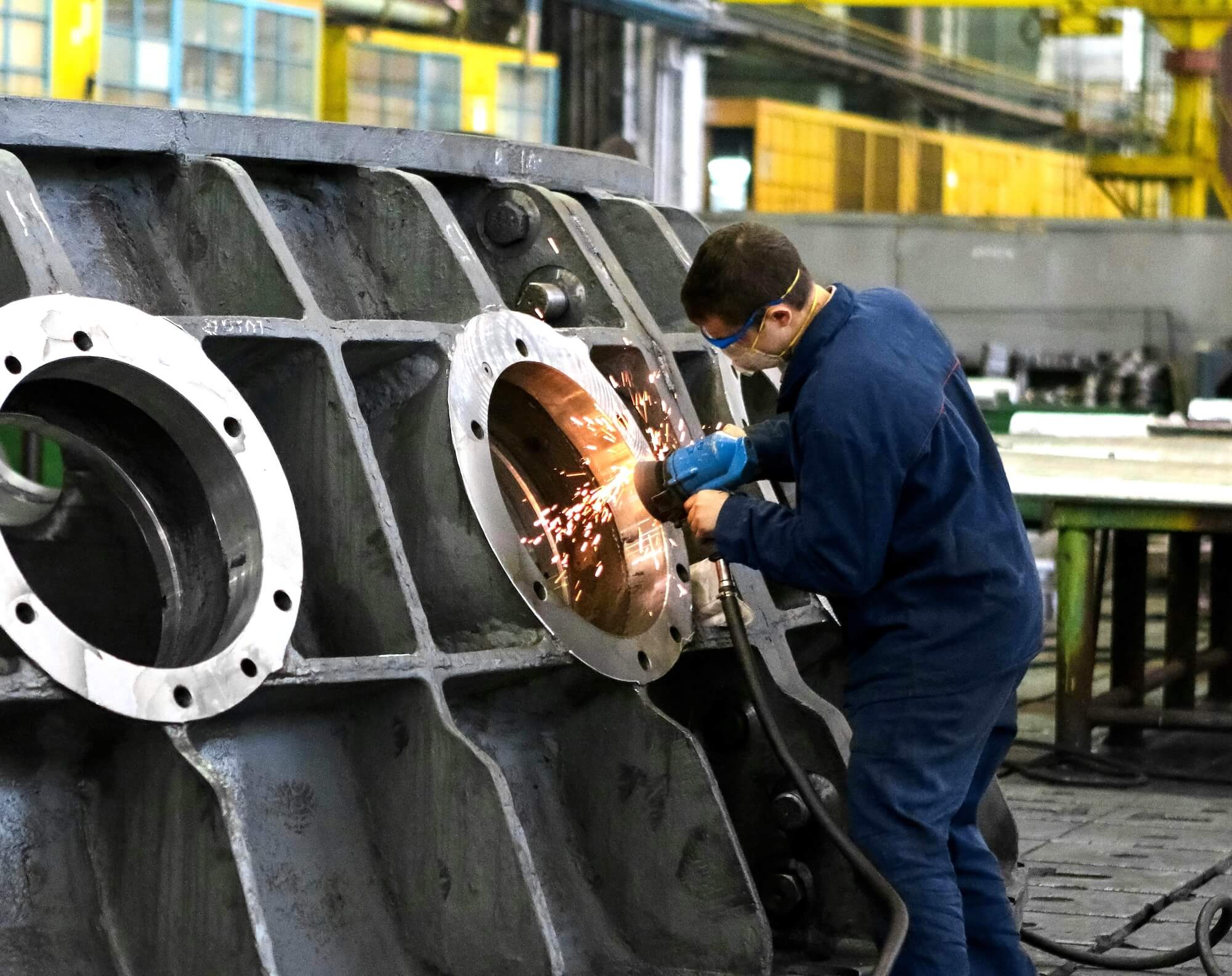 Manufacturing professional working on industrial equipment